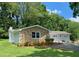 Charming stone and brick home with well-maintained landscaping and a lush green lawn at 2251 S Hairston Rd, Decatur, GA 30035