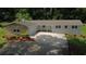 Traditional-style home with painted brick and stone accents plus an attached carport and well-manicured front yard at 2251 S Hairston Rd, Decatur, GA 30035