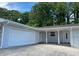 Inviting home with attached garage, painted brick, and covered front entrance at 2251 S Hairston Rd, Decatur, GA 30035
