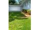 Two car garage with a well-maintained lawn and landscaped garden at 2251 S Hairston Rd, Decatur, GA 30035