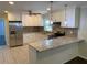 Bright kitchen showcasing white cabinetry, granite countertops, and stainless steel appliances at 2251 S Hairston Rd, Decatur, GA 30035
