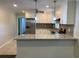 Bright kitchen showcasing white cabinetry, granite countertops, and stainless steel appliances at 2251 S Hairston Rd, Decatur, GA 30035