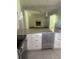 Modern kitchen featuring granite countertops, white cabinets, and stainless steel appliances at 2251 S Hairston Rd, Decatur, GA 30035