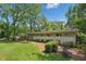 Expansive backyard featuring lush greenery, a well-manicured lawn, and mature shade trees at 3018 Monterey Dr, Decatur, GA 30032