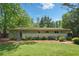 Spacious backyard features a well-maintained lawn, tasteful landscaping, and a serene, private setting at 3018 Monterey Dr, Decatur, GA 30032