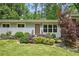 Inviting home featuring a stylish front door, manicured landscaping, and freshly painted exterior at 3018 Monterey Dr, Decatur, GA 30032