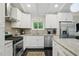 Modern kitchen featuring granite countertops, stainless steel appliances, and ample cabinet space at 3018 Monterey Dr, Decatur, GA 30032