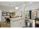 Inviting kitchen and living space with a breakfast bar and open sightlines into the living room at 3018 Monterey Dr, Decatur, GA 30032