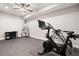 Finished basement featuring home gym area with stationary bike and punching bag, along with a study area at 3642 River Club Dr, Cumming, GA 30041