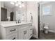 Modern bathroom with white vanity, matte black fixtures, and herringbone tile floor at 3642 River Club Dr, Cumming, GA 30041
