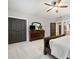 Spacious bedroom featuring neutral walls, carpet, closet, dresser, and a ceiling fan with integrated lighting at 3642 River Club Dr, Cumming, GA 30041