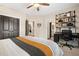 Tastefully decorated bedroom featuring a ceiling fan and open doorways to other rooms at 3642 River Club Dr, Cumming, GA 30041