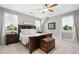 Elegant bedroom with ample natural light, hardwood furniture, and neutral tones at 3642 River Club Dr, Cumming, GA 30041