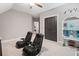 Bonus room featuring ceiling fan, grey carpet, and game chairs at 3642 River Club Dr, Cumming, GA 30041