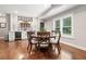 Dining area with wood floors, a built-in buffet, and a window with privacy shutters at 3642 River Club Dr, Cumming, GA 30041