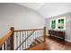 Hallway with hardwood floors, a window, and natural light at 3642 River Club Dr, Cumming, GA 30041