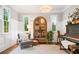 Bright living room featuring white walls, plantation shutters, hardwood floors, and stylish decor, creating a cozy atmosphere at 3642 River Club Dr, Cumming, GA 30041