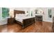 Spacious main bedroom with a fireplace, hardwood floors, and natural light at 3642 River Club Dr, Cumming, GA 30041