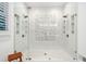 Luxurious walk-in shower featuring dual shower heads and white tile surround at 3642 River Club Dr, Cumming, GA 30041