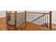 Elegant staircase featuring wood handrail and decorative iron spindles at 3642 River Club Dr, Cumming, GA 30041
