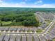 An aerial view of a community with wooded areas at 207 Hickory Bluffs Pkwy, Canton, GA 30114