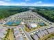 Stunning aerial perspective of a new community with a pool, tennis courts, and ample green spaces at 207 Hickory Bluffs Pkwy, Canton, GA 30114