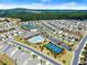 Beautiful aerial view of community amenities including a swimming pool, clubhouse, and tennis courts at 207 Hickory Bluffs Pkwy, Canton, GA 30114