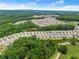 An aerial view of a new community by a wooded area at 207 Hickory Bluffs Pkwy, Canton, GA 30114