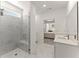 Bathroom featuring a glass enclosed shower and marble tile at 207 Hickory Bluffs Pkwy, Canton, GA 30114