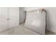 Unfurnished carpeted bedroom with white walls, featuring double doors and closet at 207 Hickory Bluffs Pkwy, Canton, GA 30114