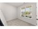 Bright, carpeted bedroom with white walls, a large window, and ample natural light at 207 Hickory Bluffs Pkwy, Canton, GA 30114