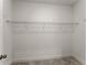 A well-lit walk-in closet with carpet and white walls is ready to be customized at 207 Hickory Bluffs Pkwy, Canton, GA 30114