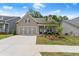 Inviting single-story home with a manicured lawn, cozy front porch, and convenient garage at 207 Hickory Bluffs Pkwy, Canton, GA 30114