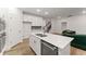 Modern kitchen with a center island, stainless steel appliances, and hardwood floors at 207 Hickory Bluffs Pkwy, Canton, GA 30114