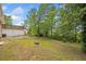 Expansive backyard featuring lush greenery and mature trees, perfect for outdoor activities and relaxation at 9 Latimer Rd, Cartersville, GA 30121