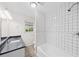 Bathroom featuring a shower with white tile and a granite countertop sink at 9 Latimer Rd, Cartersville, GA 30121