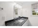 Bathroom featuring a window and granite countertop sink at 9 Latimer Rd, Cartersville, GA 30121