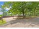 The property features a spacious driveway, fenced yard, and well-maintained landscaping, providing privacy and curb appeal at 9 Latimer Rd, Cartersville, GA 30121