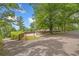 The property features a spacious driveway, fenced yard, and well-maintained landscaping, providing privacy and curb appeal at 9 Latimer Rd, Cartersville, GA 30121