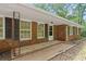 Inviting front porch with brick accents and classic architectural details at 9 Latimer Rd, Cartersville, GA 30121