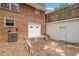 Back exterior showing the garage with a new white garage door, convenient access, and adjacent brick architecture at 9 Latimer Rd, Cartersville, GA 30121