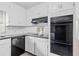 Bright kitchen with white cabinets and a built-in oven, offering ample storage and functionality at 9 Latimer Rd, Cartersville, GA 30121