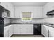 Traditional kitchen featuring white cabinets, black appliances, subway tile, and ample counter space at 9 Latimer Rd, Cartersville, GA 30121