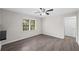 Cozy living room featuring neutral walls, a ceiling fan, and a nearby doorway at 9 Latimer Rd, Cartersville, GA 30121
