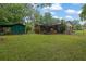 An expansive backyard featuring a storage shed, a covered patio, and lots of room for outdoor fun at 1125 Lanier Sw Dr, Marietta, GA 30060