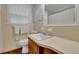 Well-lit bathroom with a vanity, mirror, and a toilet and tub with a shower curtain at 1125 Lanier Sw Dr, Marietta, GA 30060