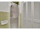A tiled bathroom featuring a glass-door shower, providing a clean and functional space with a focus on practicality and easy maintenance at 1125 Lanier Sw Dr, Marietta, GA 30060