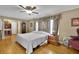 Comfortable bedroom featuring hardwood floors and neutral tones at 1125 Lanier Sw Dr, Marietta, GA 30060