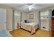 Cozy bedroom with hardwood floors and a comfortable double bed at 1125 Lanier Sw Dr, Marietta, GA 30060