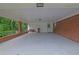 Spacious carport with brick accents, providing ample covered parking and storage at 1125 Lanier Sw Dr, Marietta, GA 30060